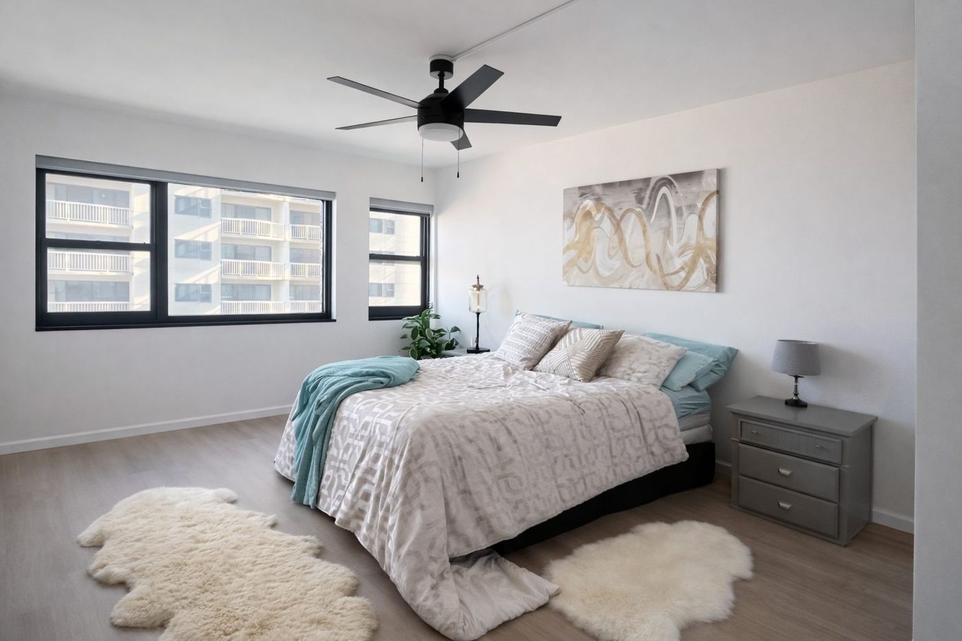 Renovated condo bedroom with ocean-view windows