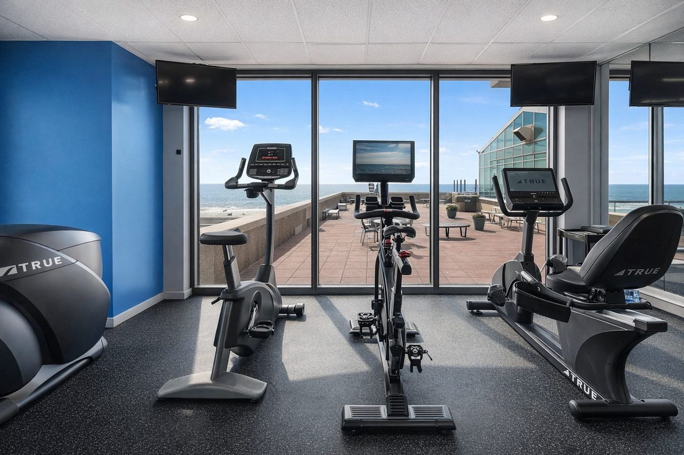 Building fitness room with ocean views