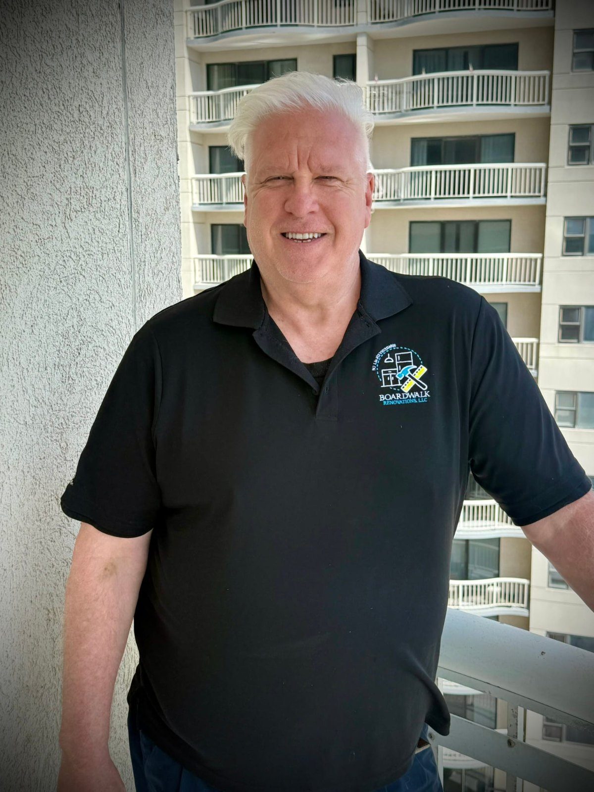 Jim O'Neill, owner of Boardwalk Renovations, on a high-rise balcony
