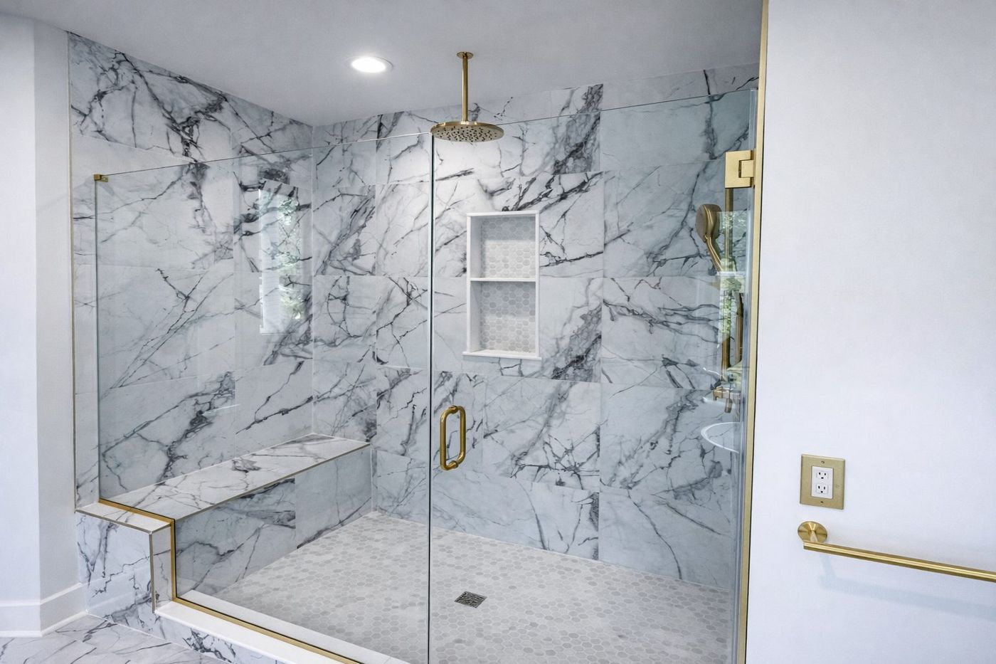 Marble walk-in shower with brass fixtures